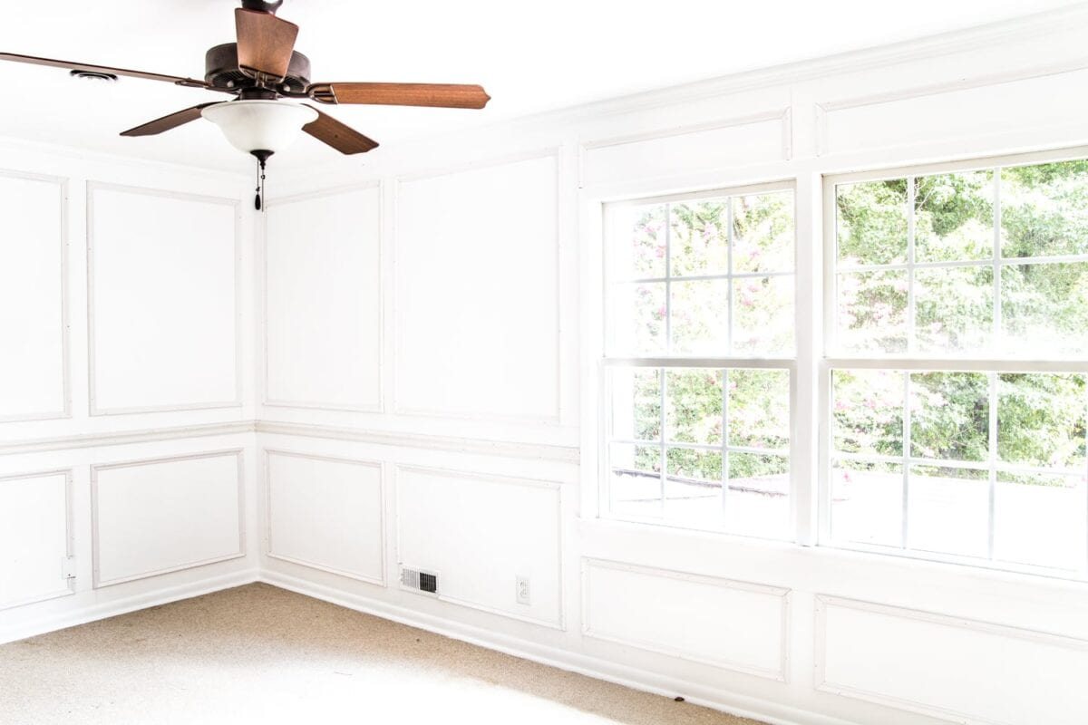 A step-by-step tutorial for hanging picture frame molding wainscoting and a shortcut to make it easier.