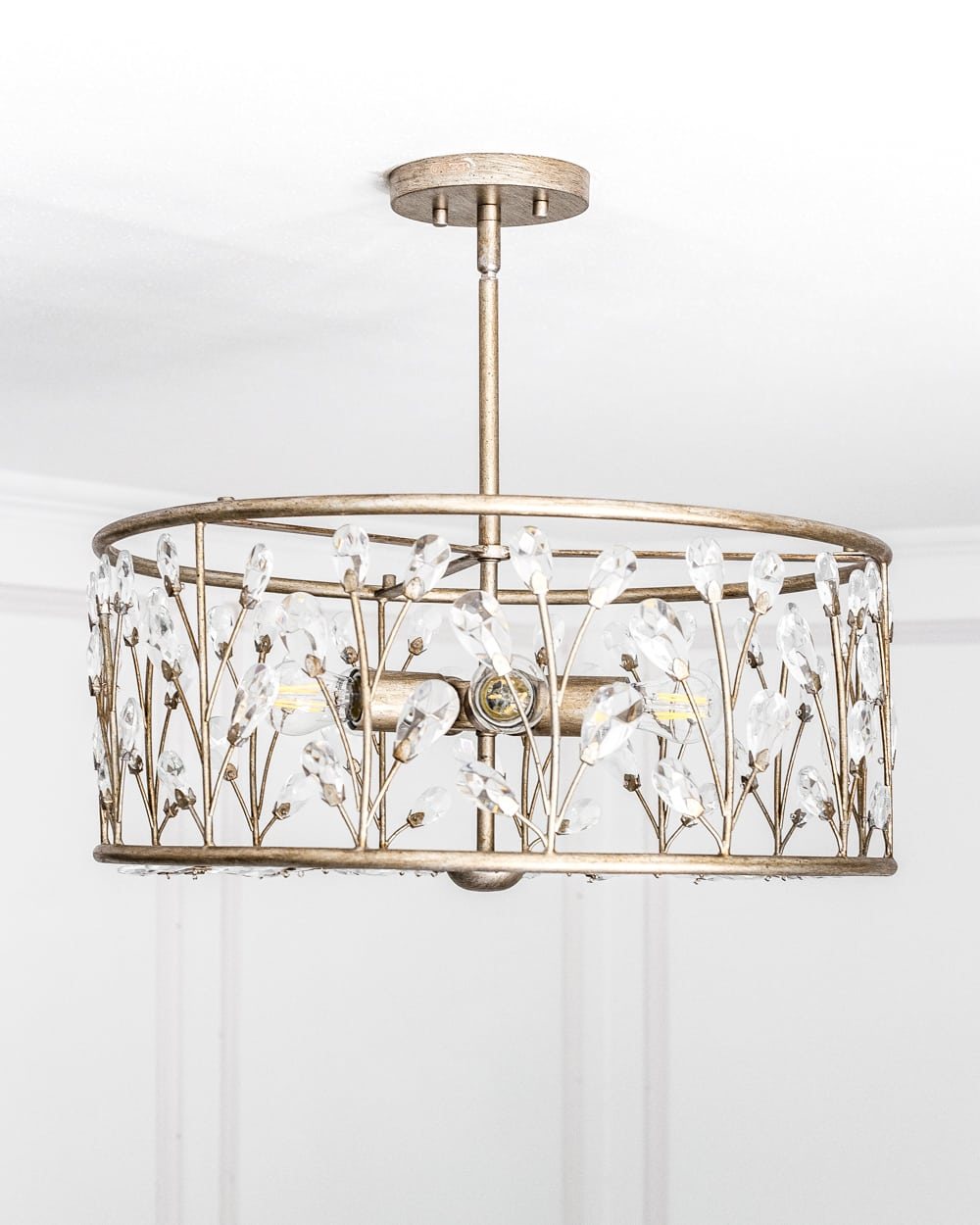 A feminine, vintage, glam lighting update for a baby girl's nursery makeover. #nurserylighting #lightfixture #glamdecor #vintagedecor
