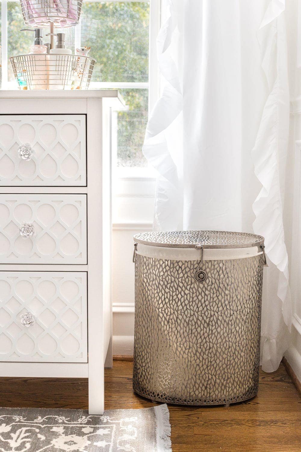 Nursery Organization | Use a lidded hamper with a liner for easy washing and to contain baby smells.