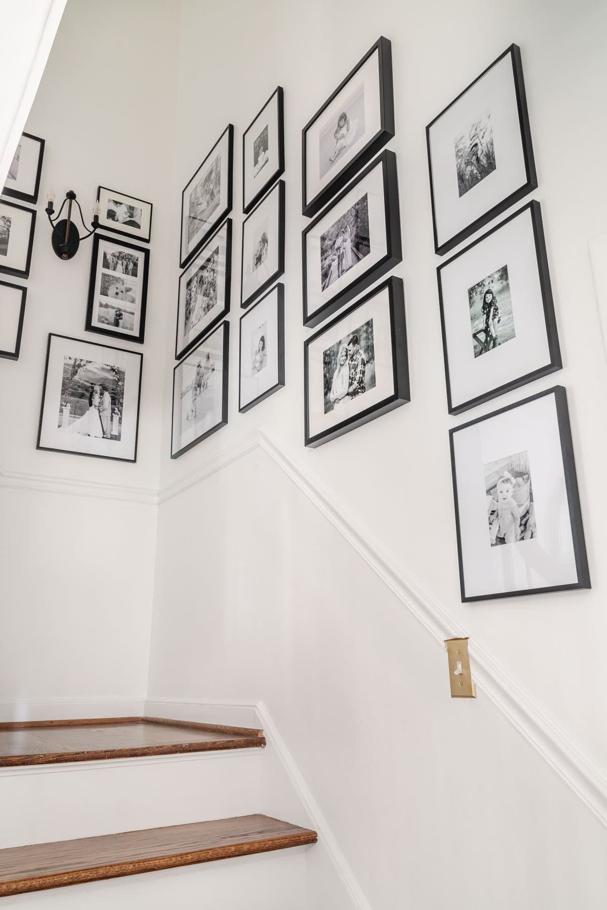 black and white staircase gallery wall