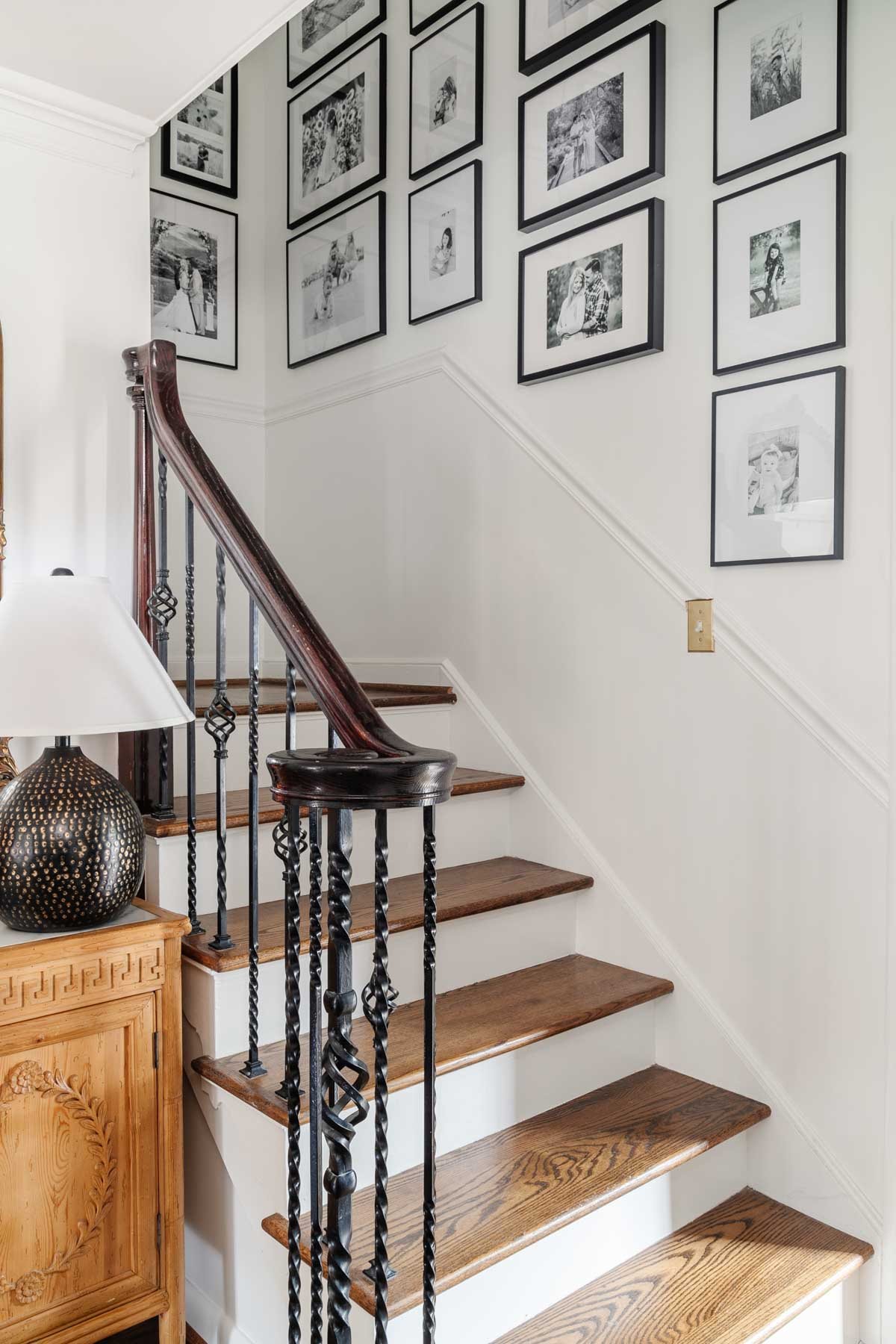 gallery wall with black frames and black and white photos