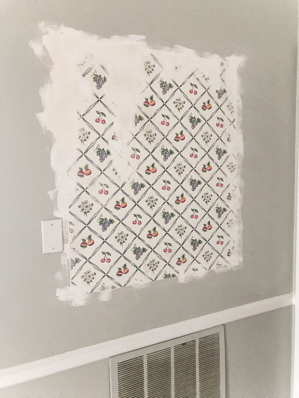 wallpaper exposed behind a shelf