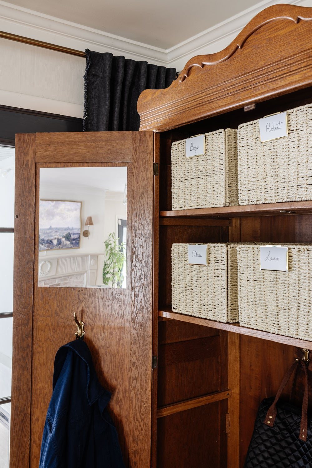 armoire coat closet in an entryway for storage without a mudroom