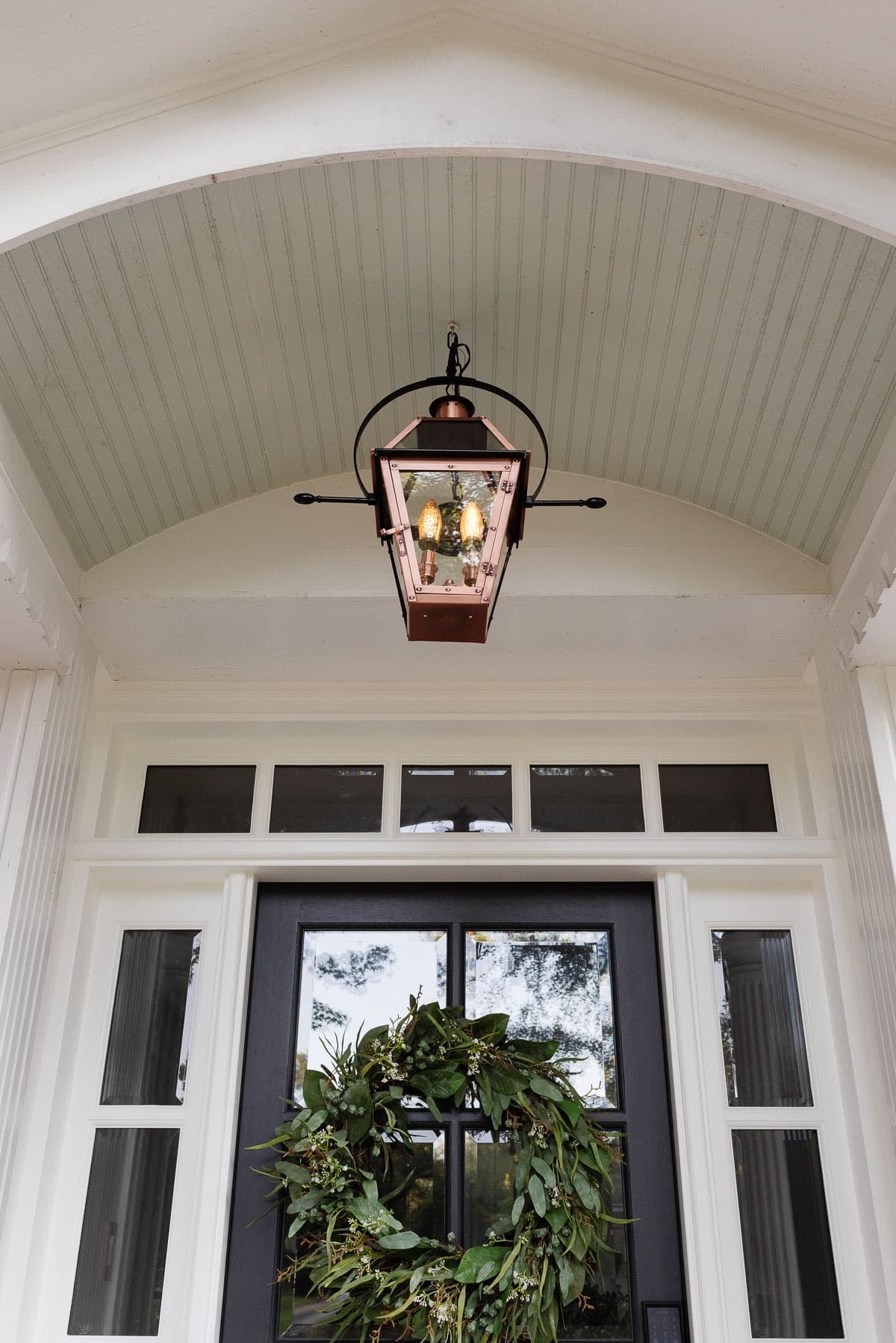 copper lantern fixture on a porch