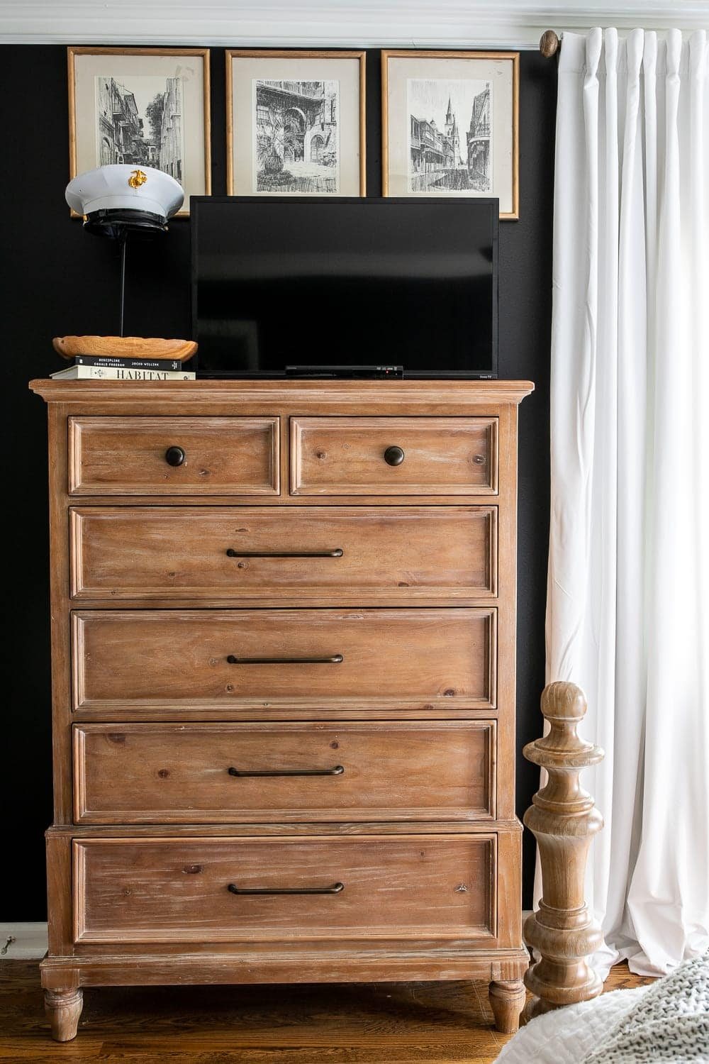 Bedroom TV disguised on dresser top with black paint