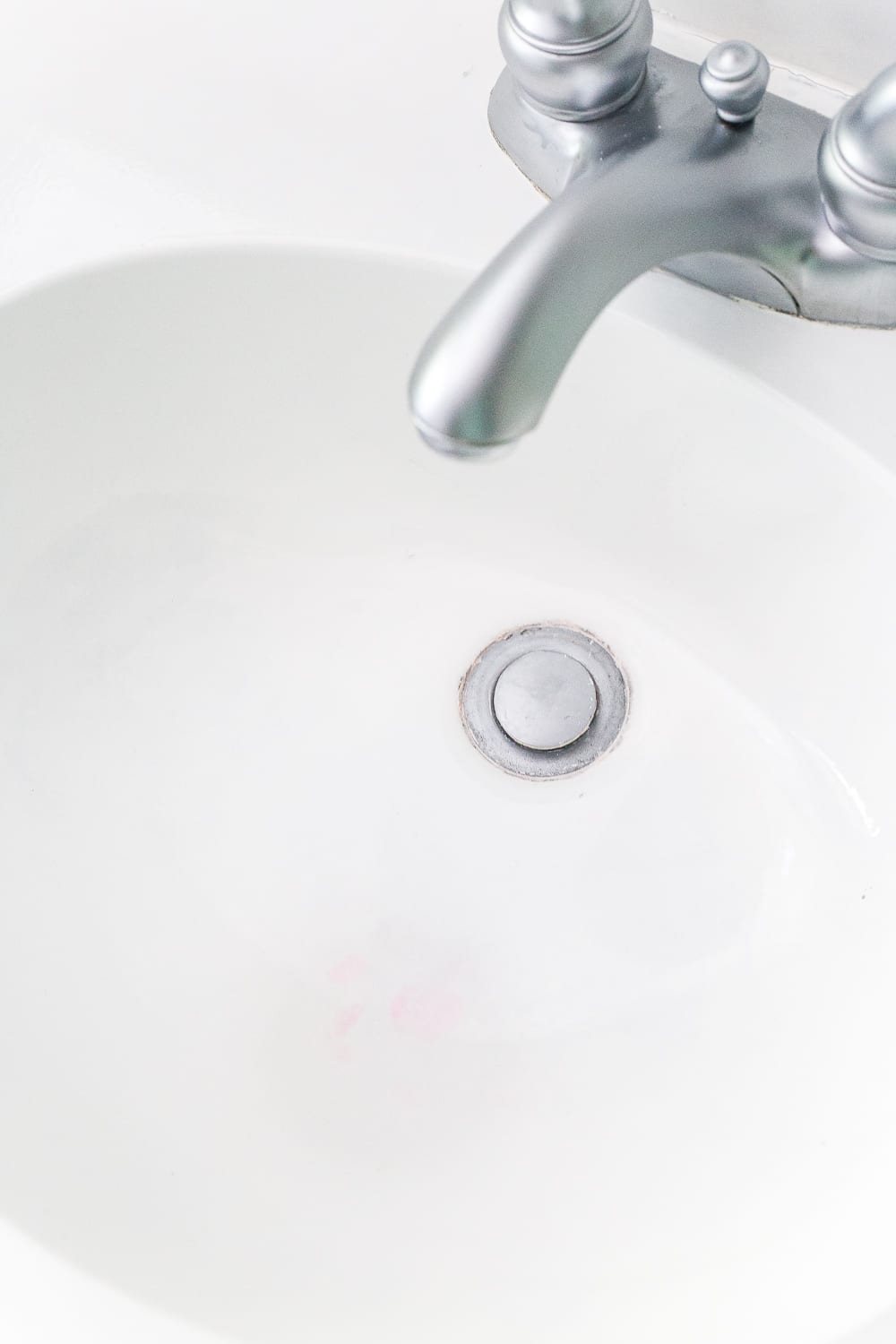 How to paint a sink, countertop, tub, and shower for $100 and how to make it last using Rustoleum Tub & Tile Refinishing Kit #bathroom #bathroommakeover #diyproject #homeimprovement #paintedsink #paintedcountertop #paintedtub #paintedshower
