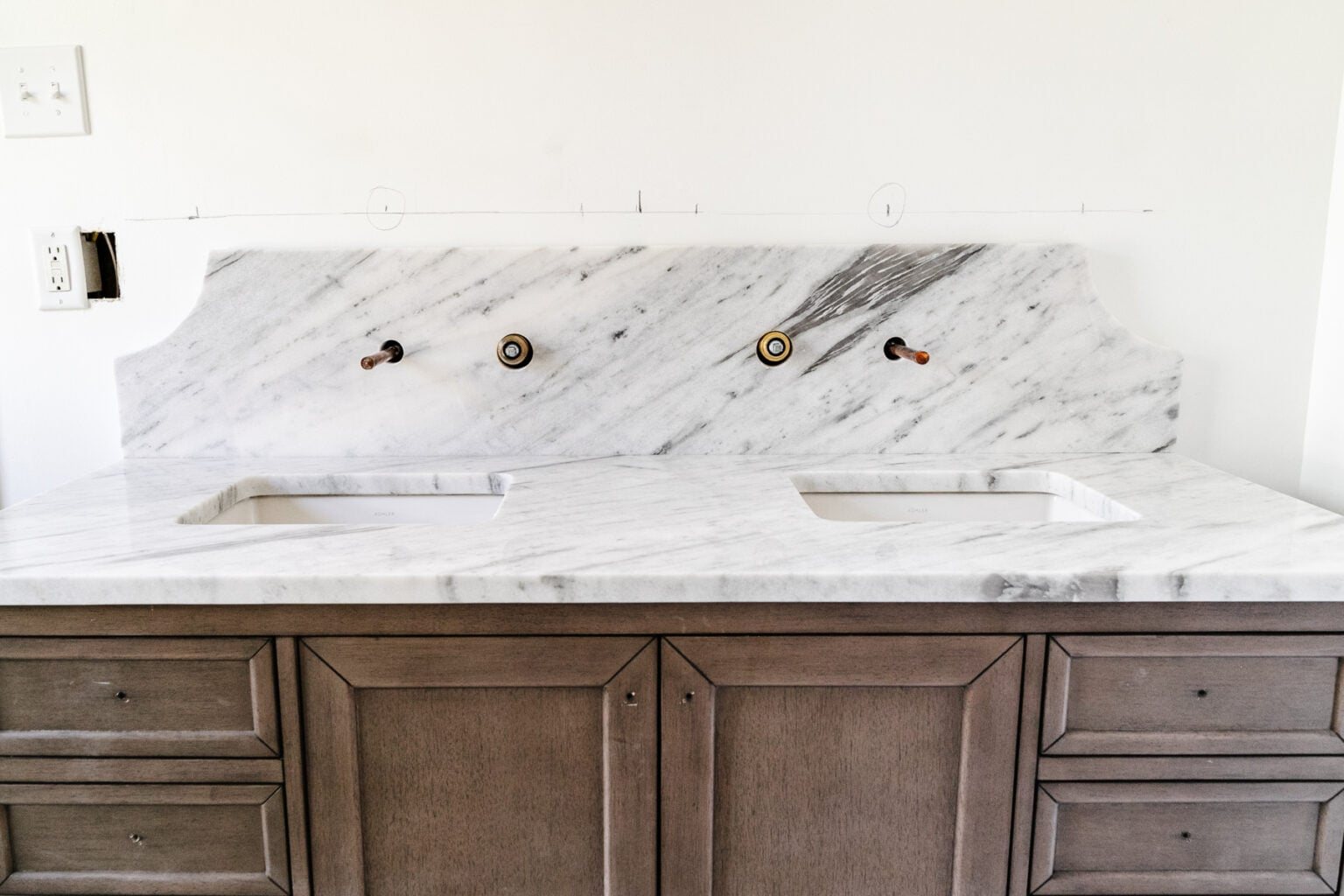 marble countertop and scalloped backsplash