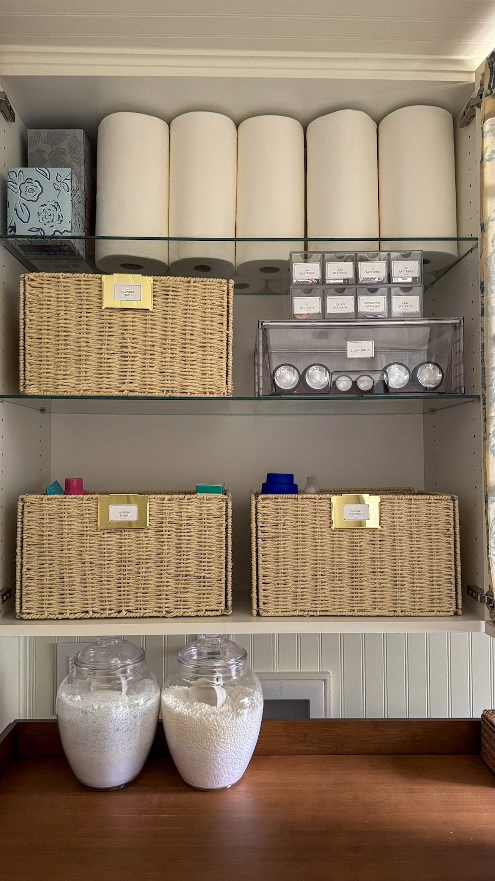 small laundry room organization - labeled bins