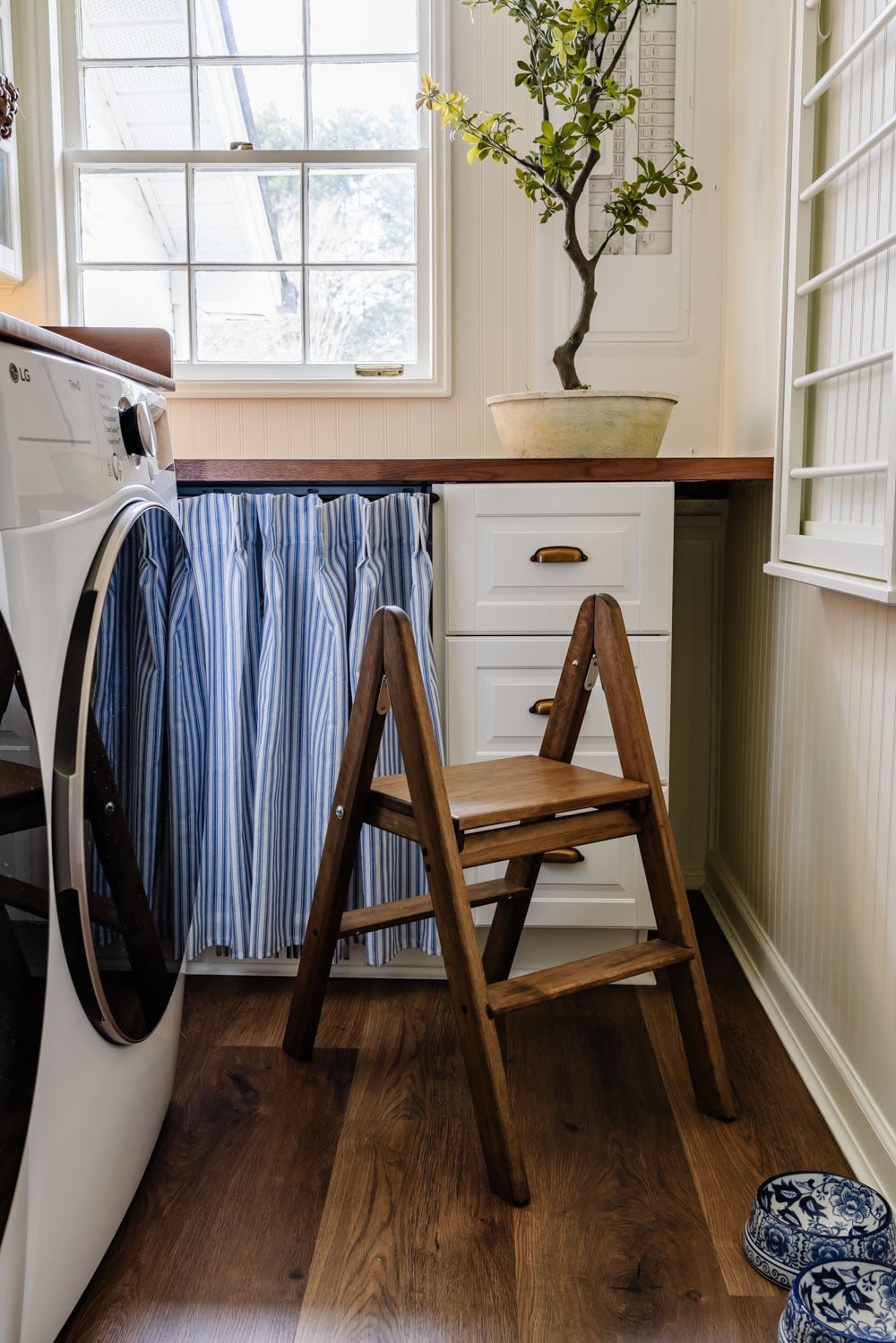 small laundry room organization - folding step stool