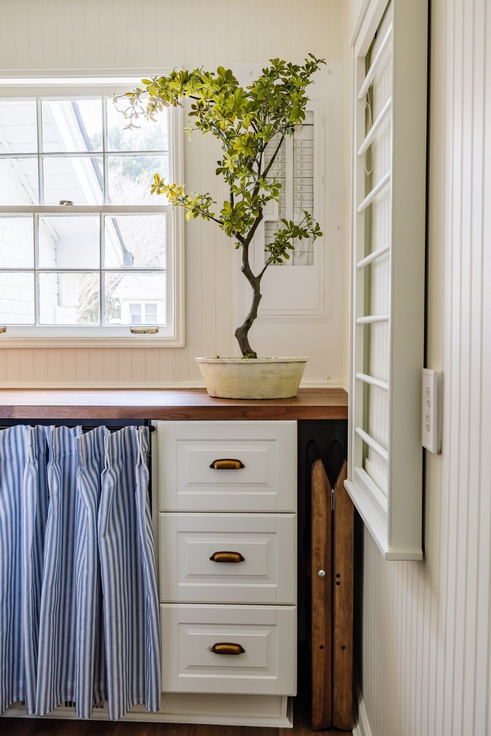 small laundry room organization - step stool storage