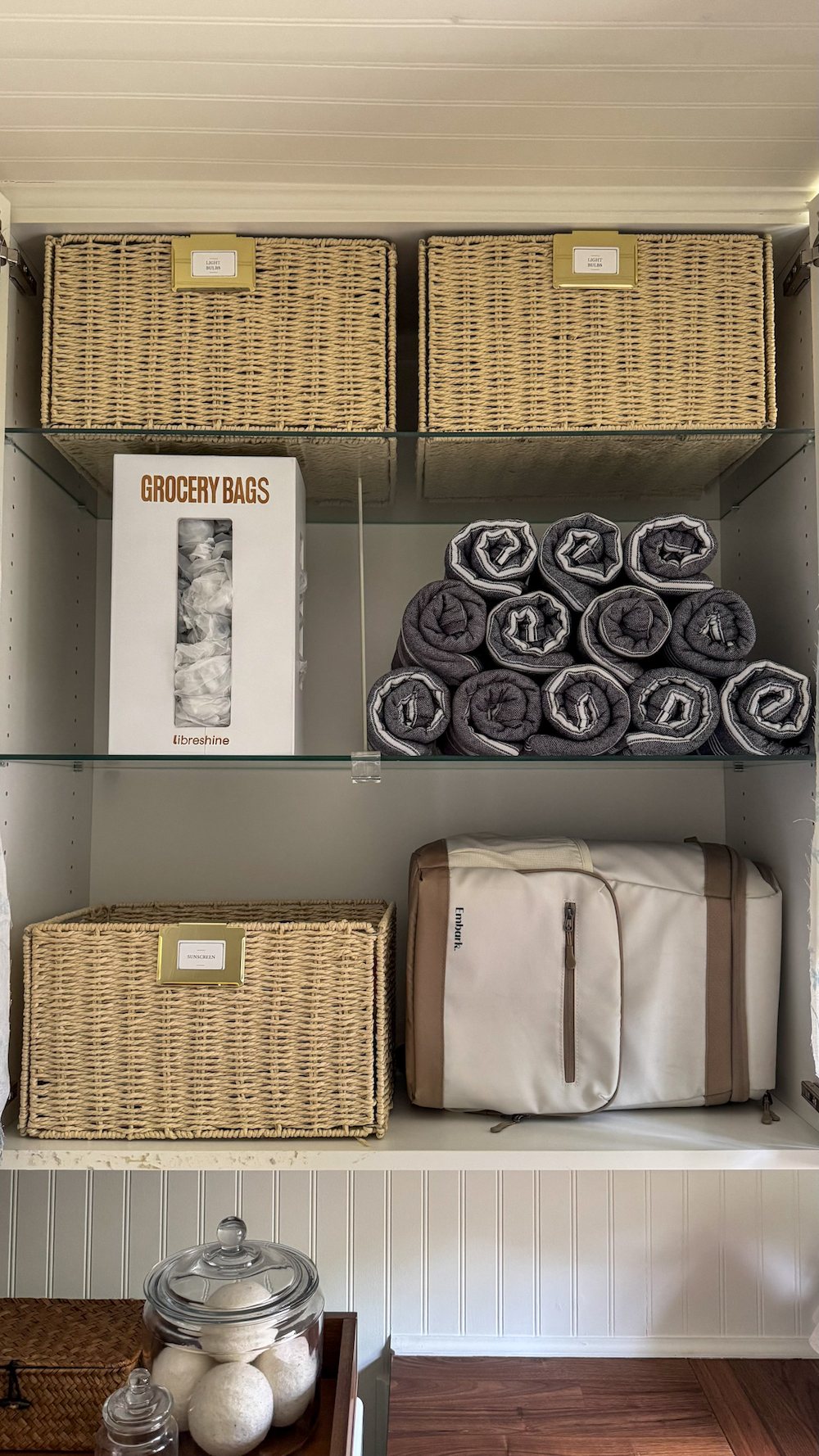 small laundry room organization - labeled bins