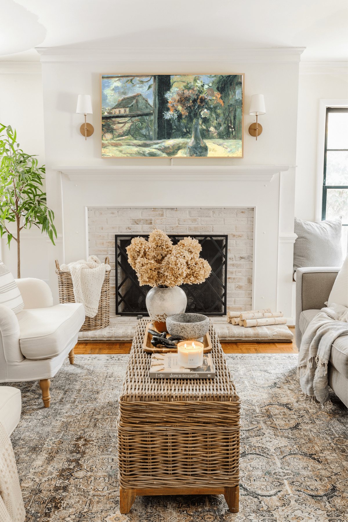 Samsung Frame TV in living room with still life art