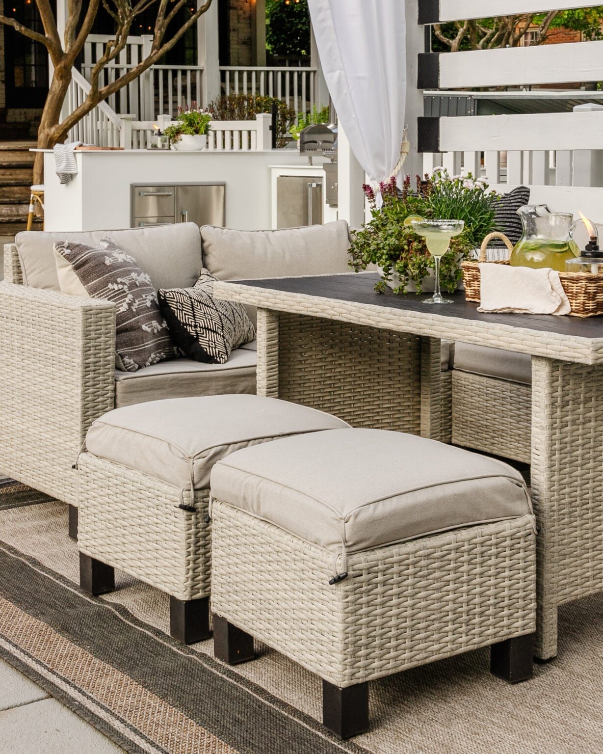 outdoor dining set in a backyard pool cabana