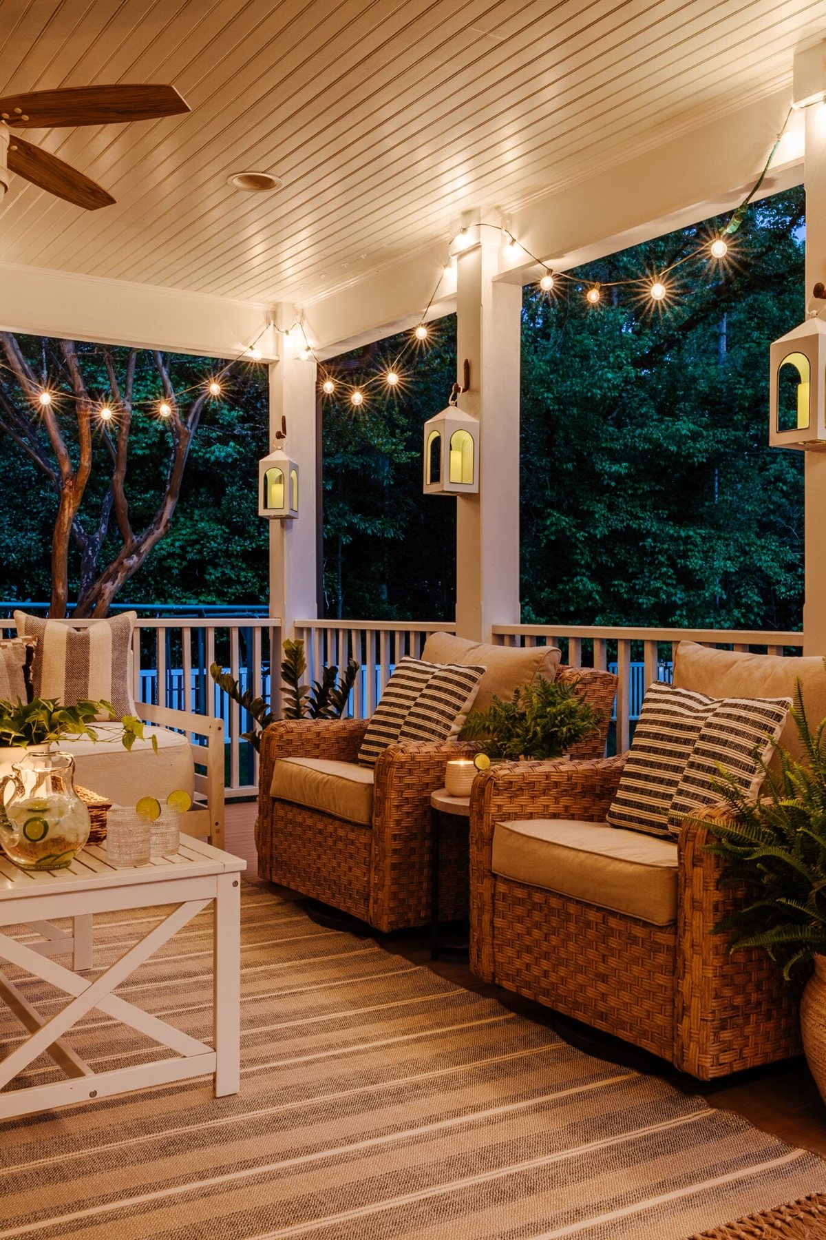 back porch at night with string lights and lanterns
