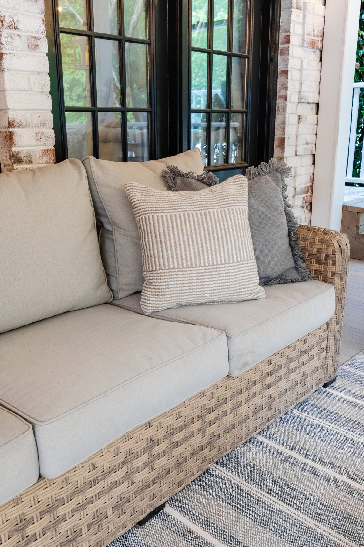 wicker outdoor sofa on a back porch
