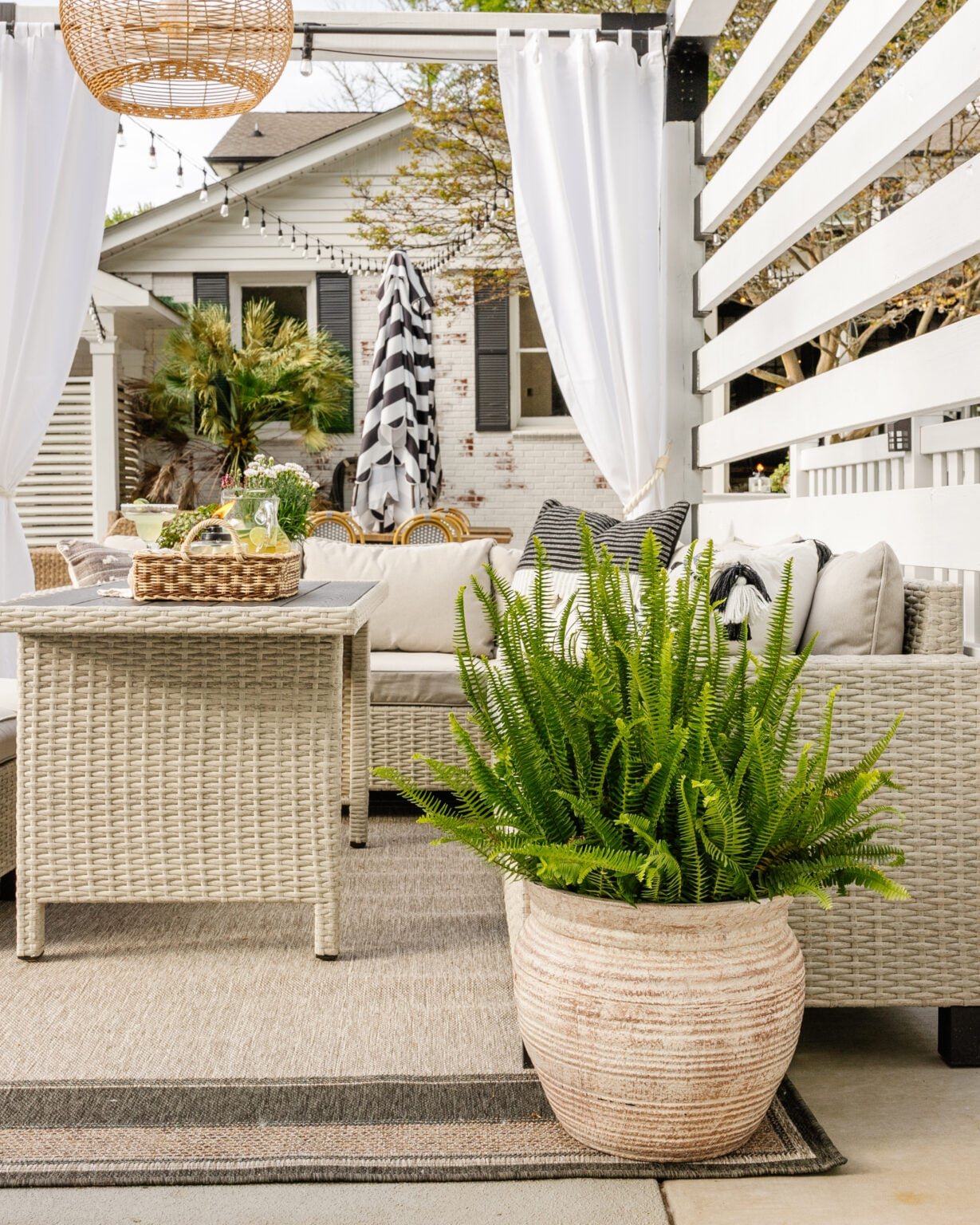backyard cabana with outdoor dining set