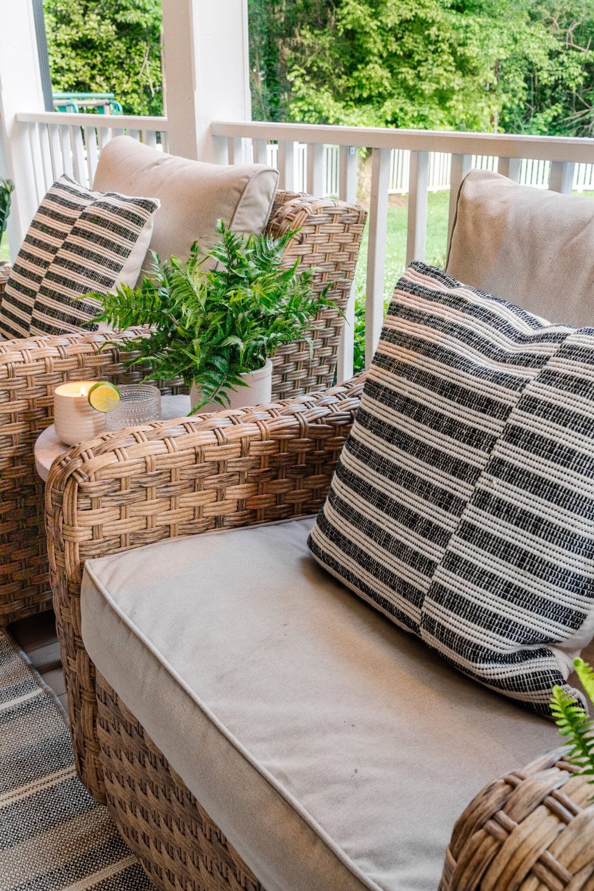 back porch wicker chairs with faux fern on table