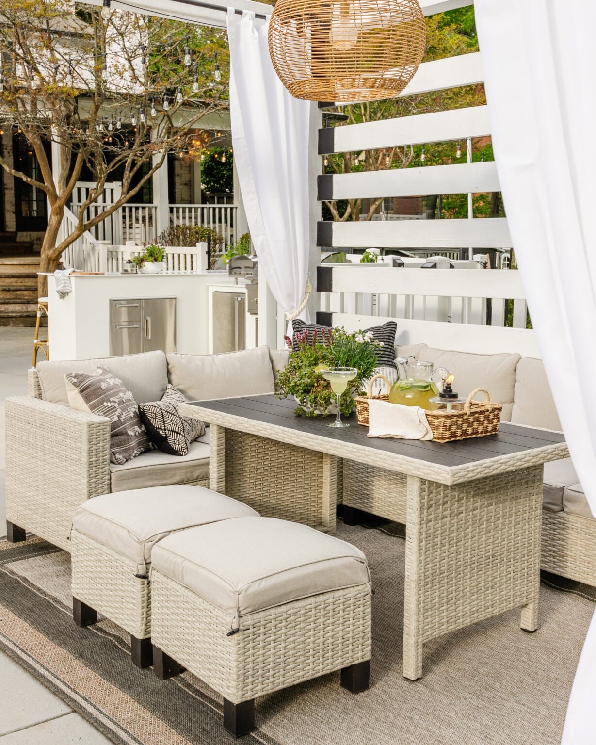 backyard pool cabana with wicker sectional dining set