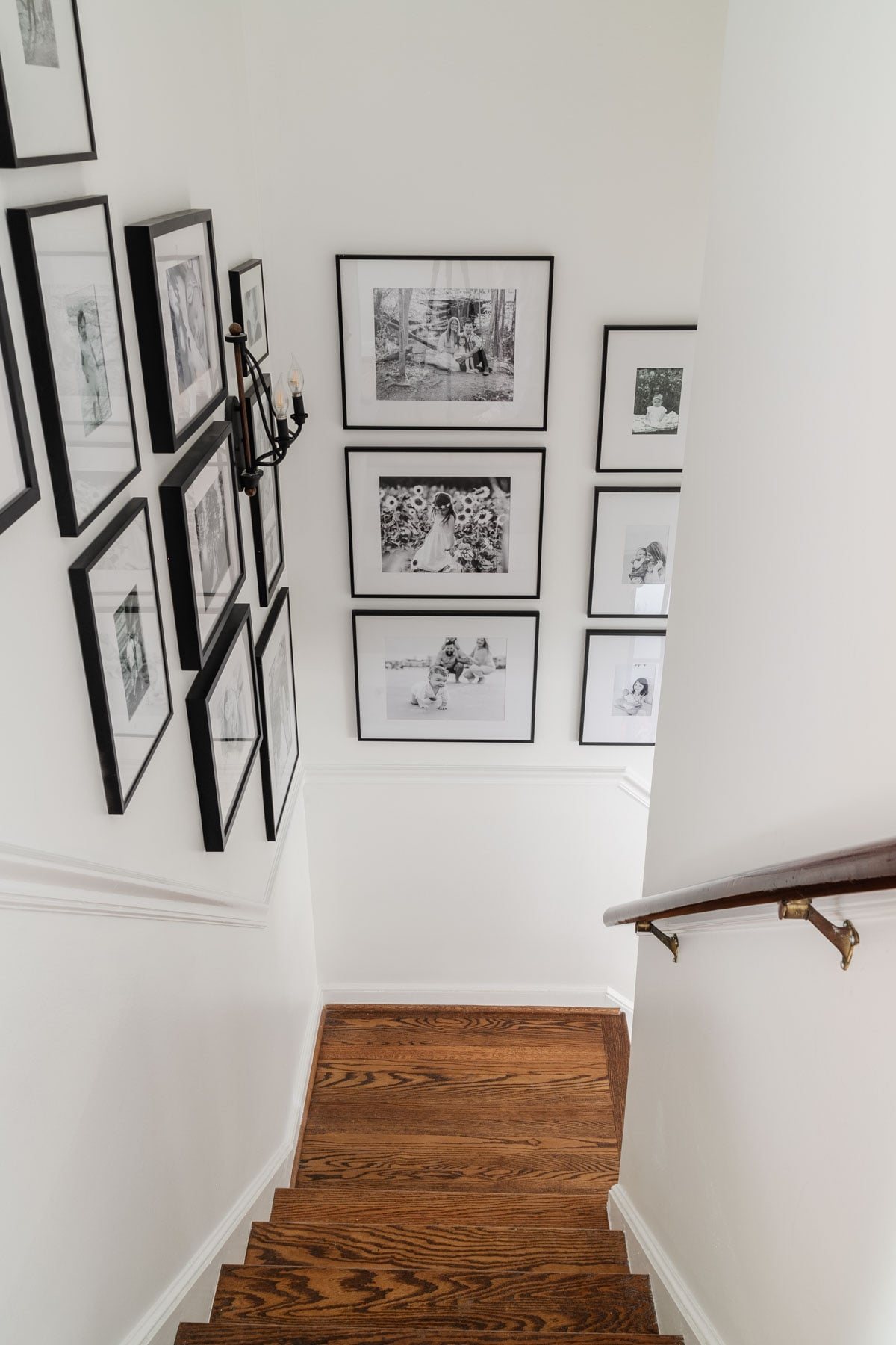 stairway with gallery wall using Benjamin Moore Chantilly Lace