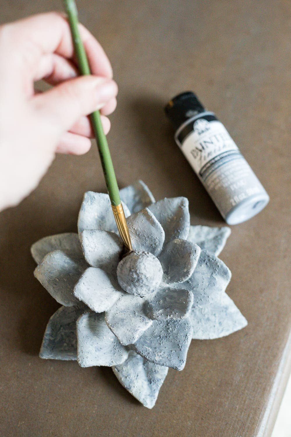 A quick and simple tutorial for how to make anything look like concrete with craft paint. #crafting #painting #thriftydecor