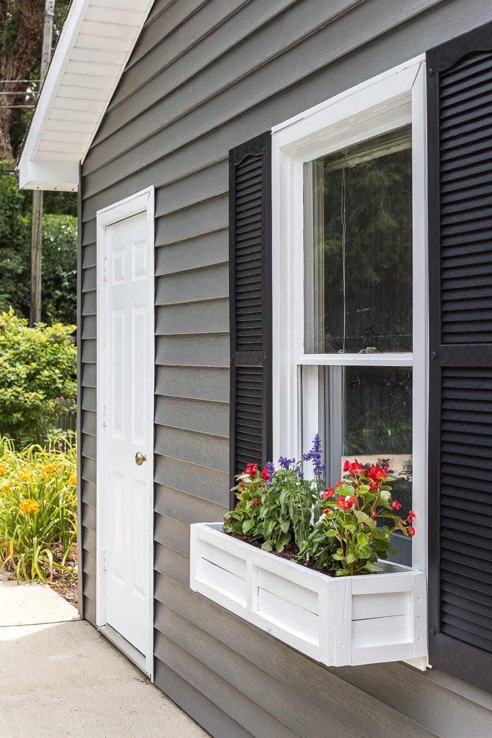 Pool shed makeover using VinylSafe paint for painting vinyl siding in Sherwin Williams VinylSafe + DIY window box using repurposed scrap wood