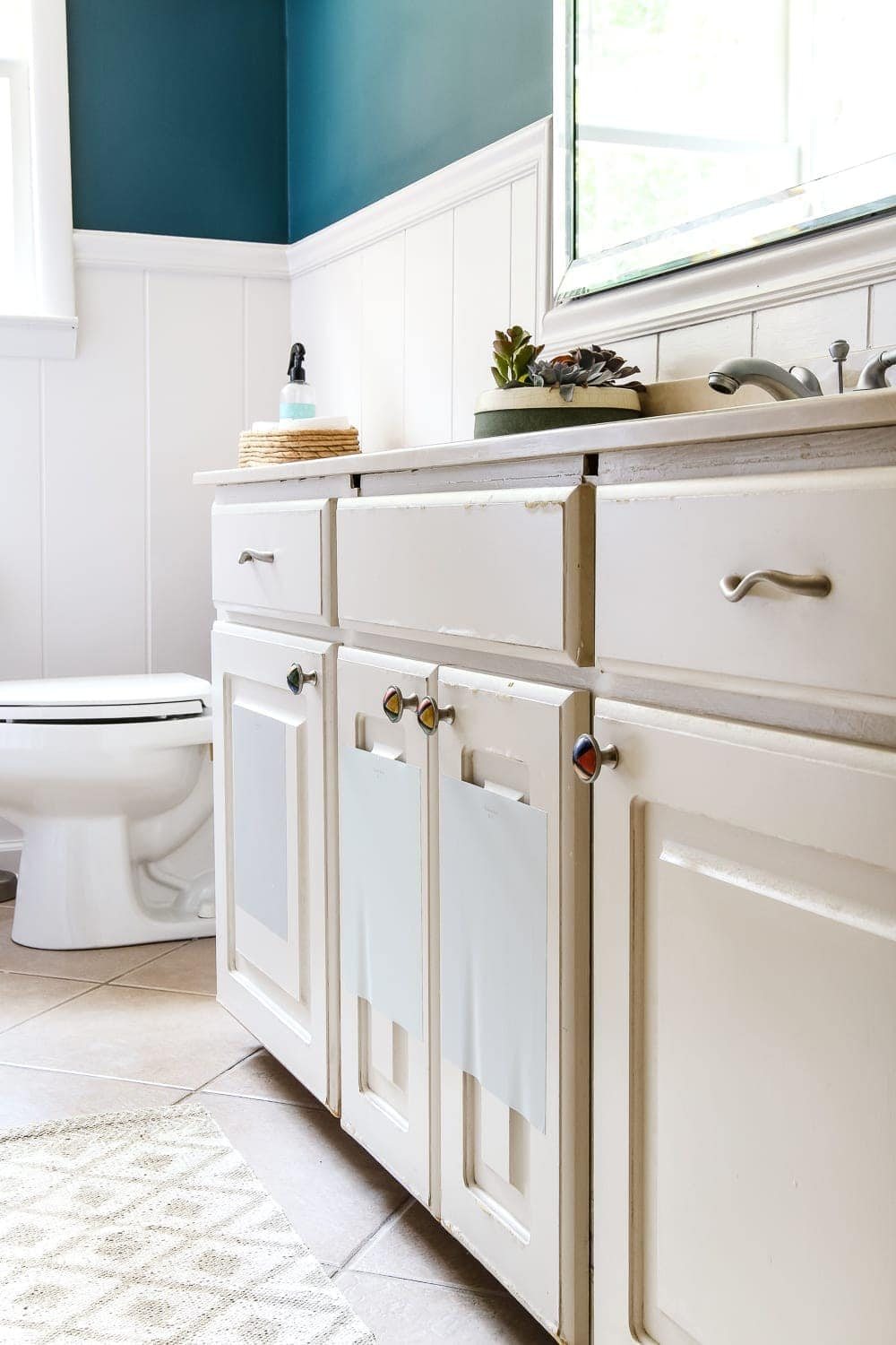 Painted Cabinet Bathroom Update | unigumushane.com - A dated cabinet gets a refresh with Benjamin Moore Coventry Gray for an inexpensive bathroom update. #cabinetpainting #homeimprovement #bathroom