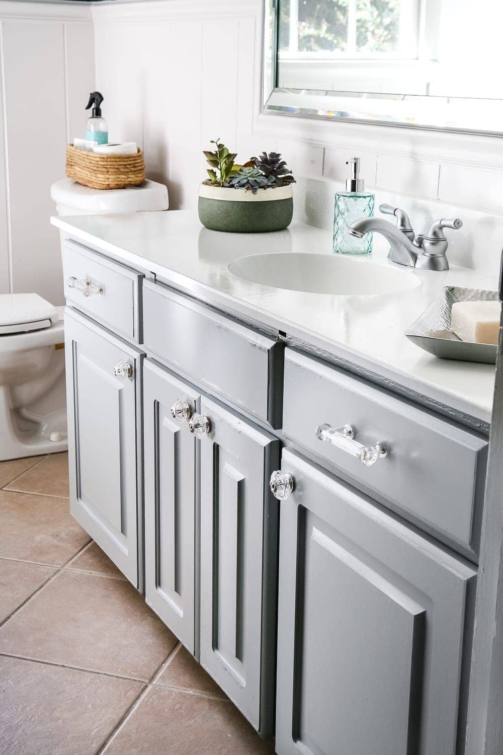 Painted Cabinet Bathroom Update | unigumushane.com - A dated cabinet gets a refresh with Benjamin Moore Coventry Gray for an inexpensive bathroom update. #cabinetpainting #homeimprovement #bathroom
