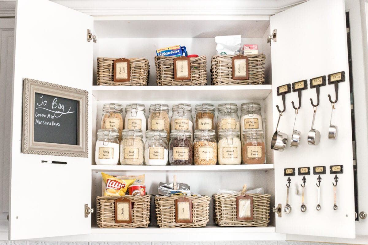 Pantry Cabinet Organization and Free Printable Label Set | unigumushane.com - A cabinet gets a drastic organization makeover using inexpensive IKEA jars / baskets, hanging storage, and a free pantry label printable set. #organization