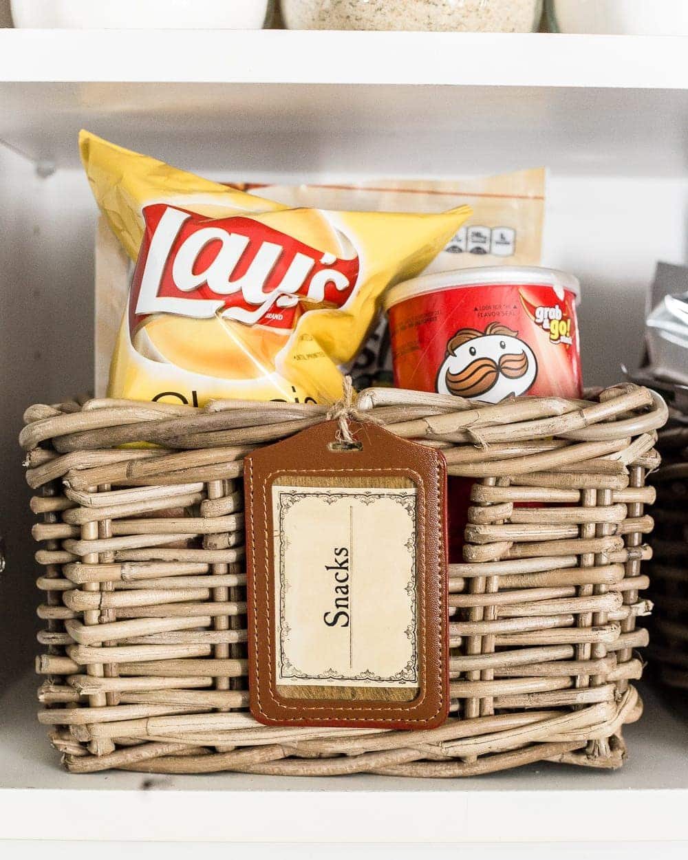 Pantry Cabinet Organization and Free Printable Label Set | unigumushane.com - A cabinet gets a drastic organization makeover using inexpensive IKEA jars / baskets, hanging storage, and a free pantry label printable set. #organization