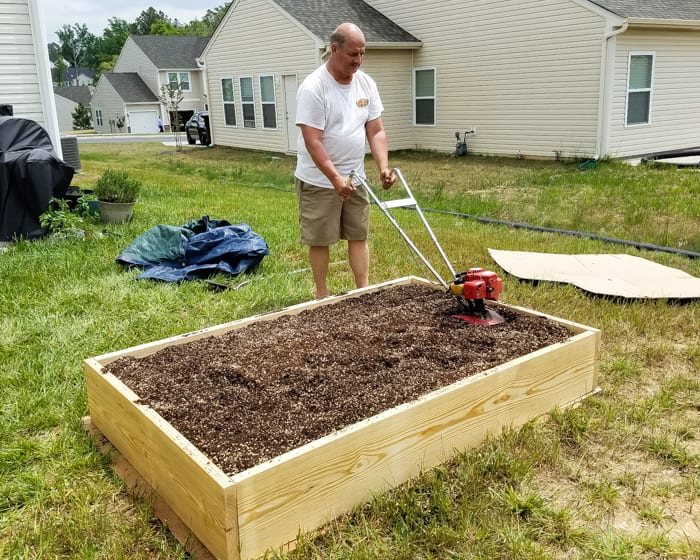 tilling soil mixture for preparing a raised bed vegetable garden frame