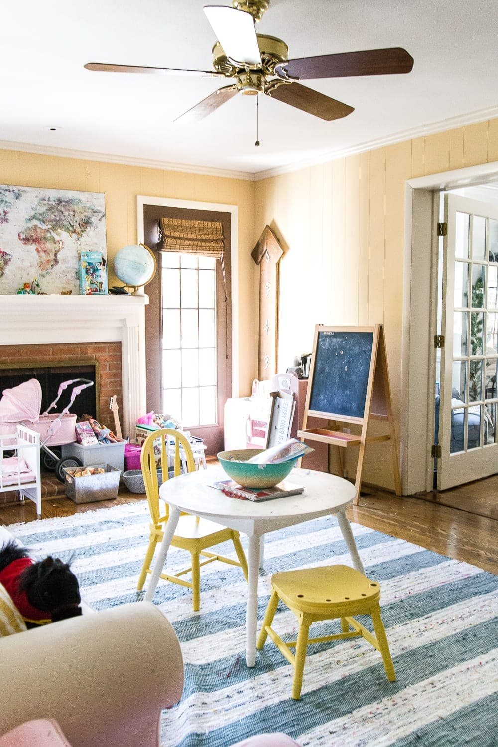 A dated, unorganized playroom gets a bright and whimsical makeover with organizational strategies, ideas for adding function, and DIY-able projects to create the perfect kid's space on a budget. #kidsroom #playroom #kidsdecor #toyorganizing