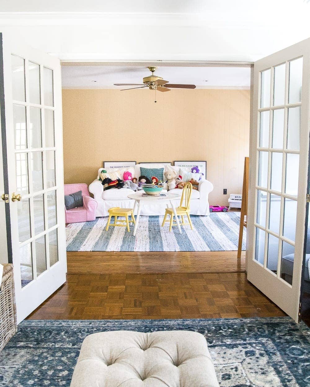 A dated, unorganized playroom gets a bright and whimsical makeover with organizational strategies, ideas for adding function, and DIY-able projects to create the perfect kid's space on a budget. #kidsroom #playroom #kidsdecor #toyorganizing