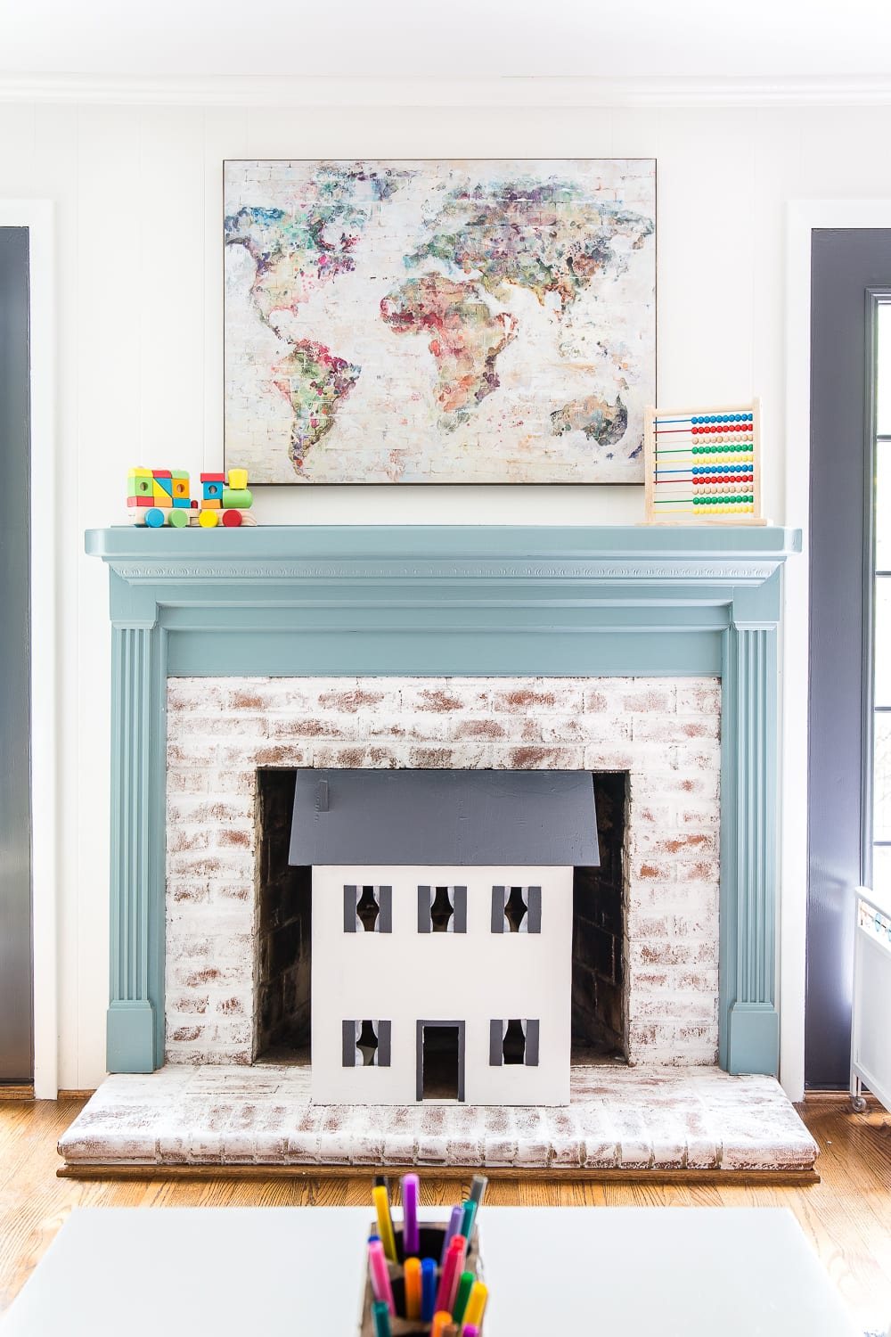 A dated, unorganized playroom gets a bright and whimsical makeover with organizational strategies, ideas for adding function, and DIY-able projects to create the perfect kid's space on a budget. #kidsroom #playroom #kidsdecor #toyorganizing