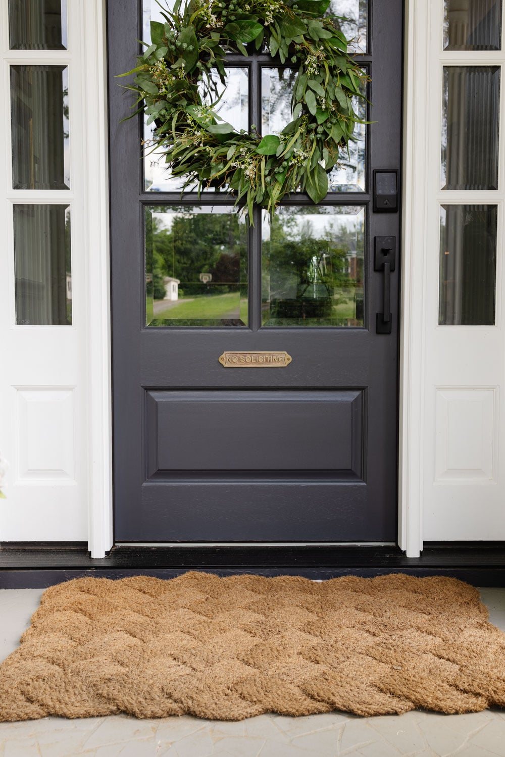 no soliciting brass sign on door
