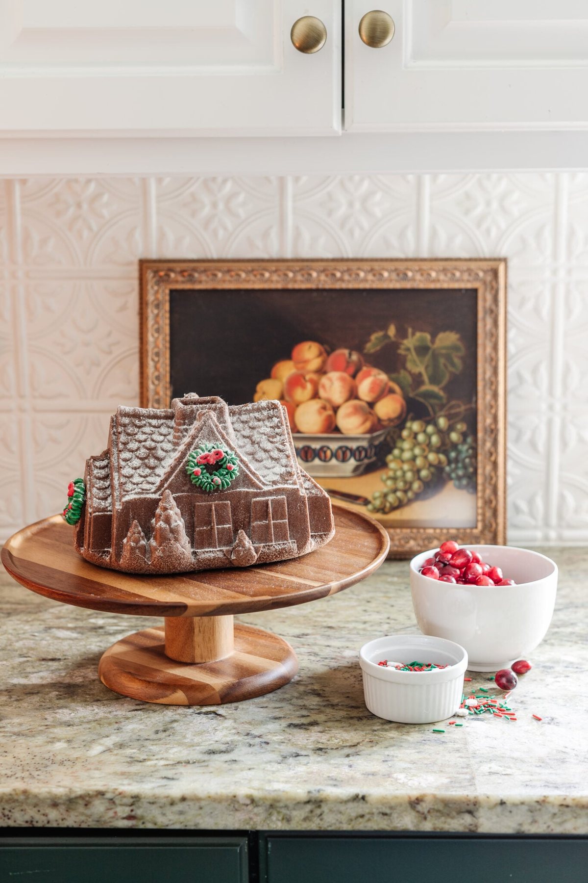 countertop kitchen Christmas decor using a fake gingerbread house
