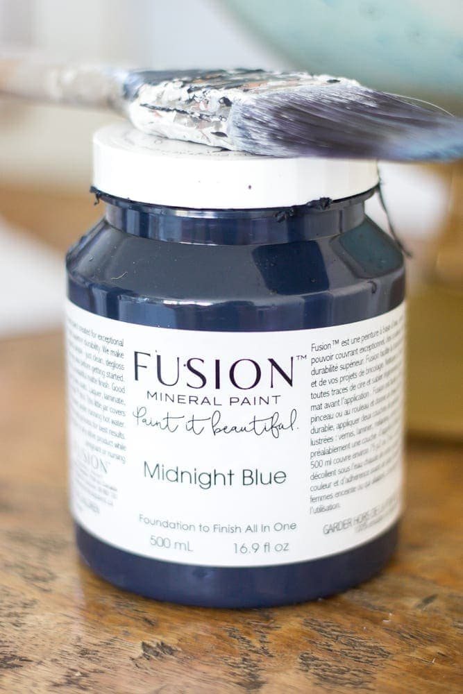 Repurposed Kitchen Table Turned Desks | unigumushane.com - How to use a repurposed kitchen table to cut in half and make wall-mounted desks for a playroom makeover with Fusion Mineral Paint Midnight Blue.