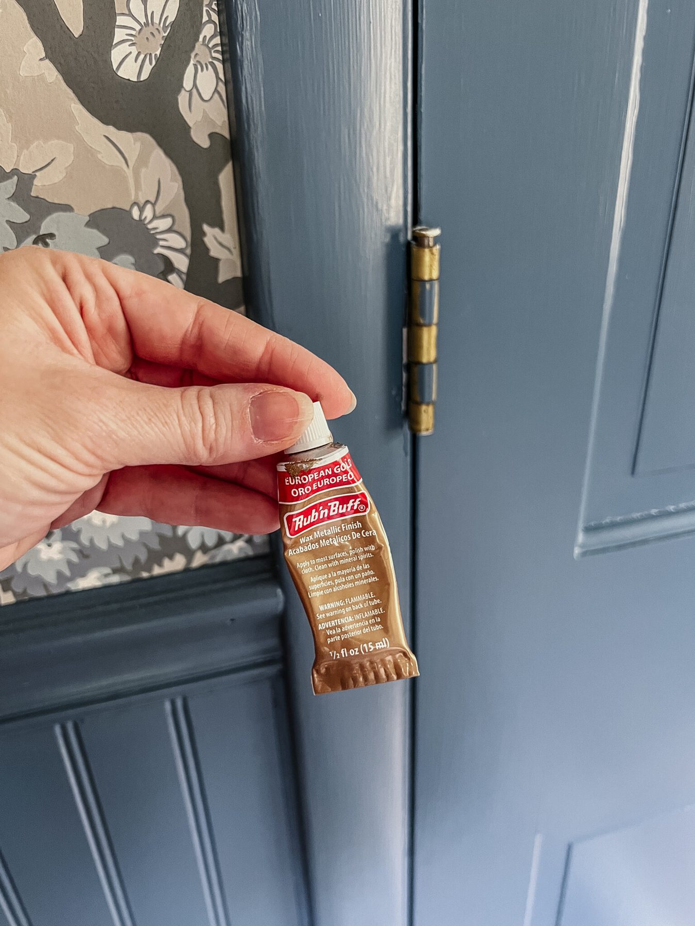 Using European Gold Rub n Buff on door hinges to change the color