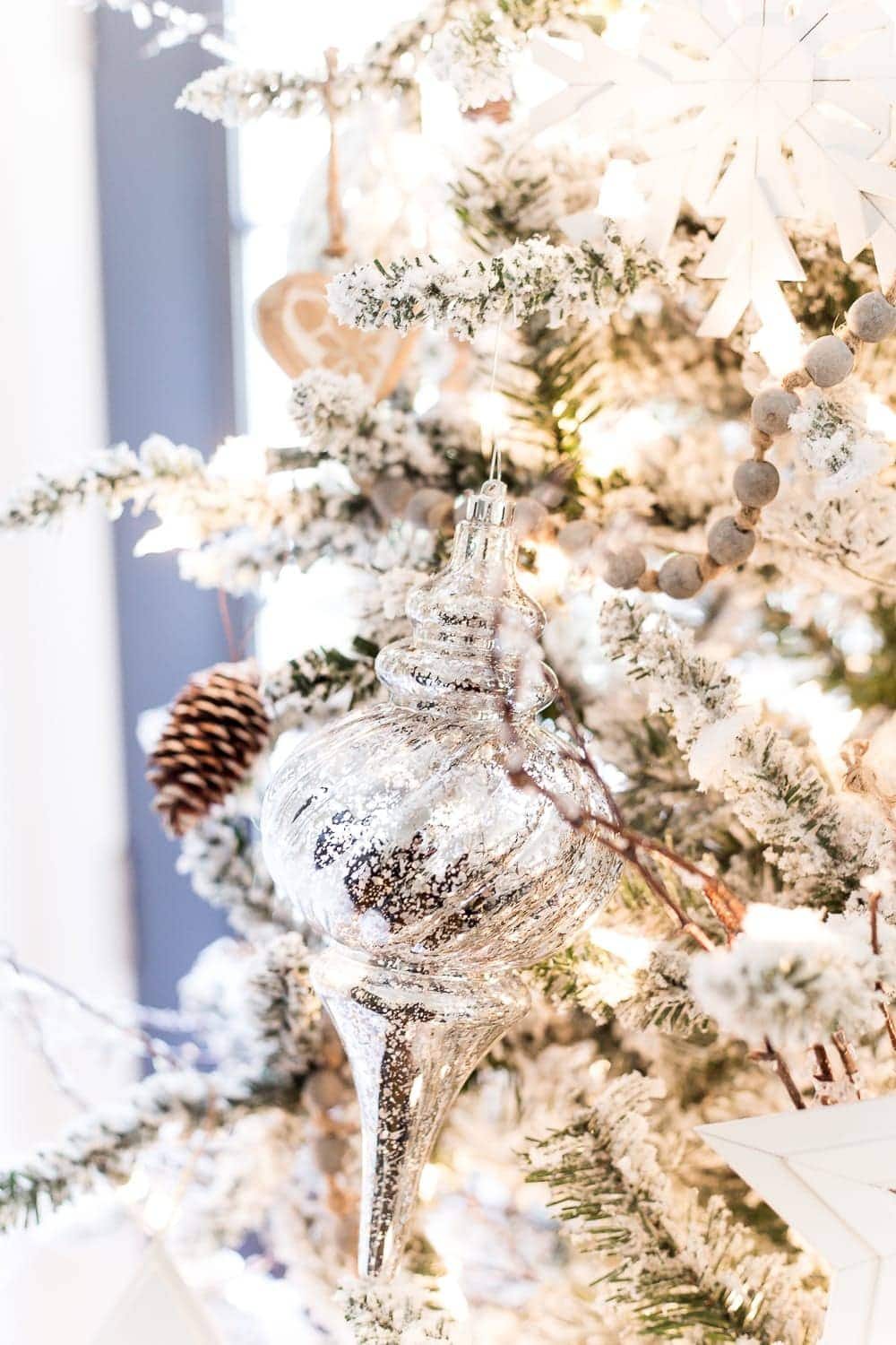 Seasonal Simplicity Christmas Living Room | unigumushane.com - A tour of a neutral Christmas living room with simple, natural decor, mercury glass, and a modern rustic vibe. #christmaslivingroom #neutralchristmas #christmasdecor