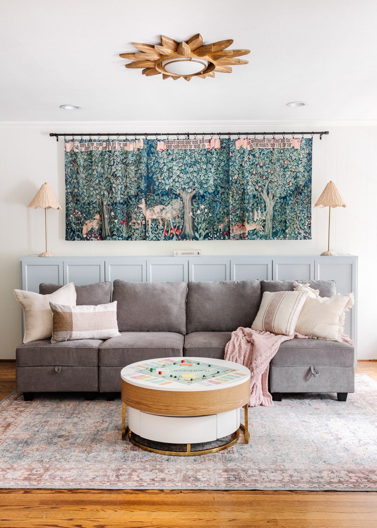 playroom with sectional sofa using modular chairs, cabinet, and round coffee table