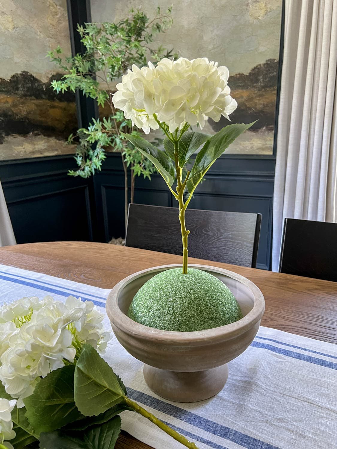faux flower placed in florist foam