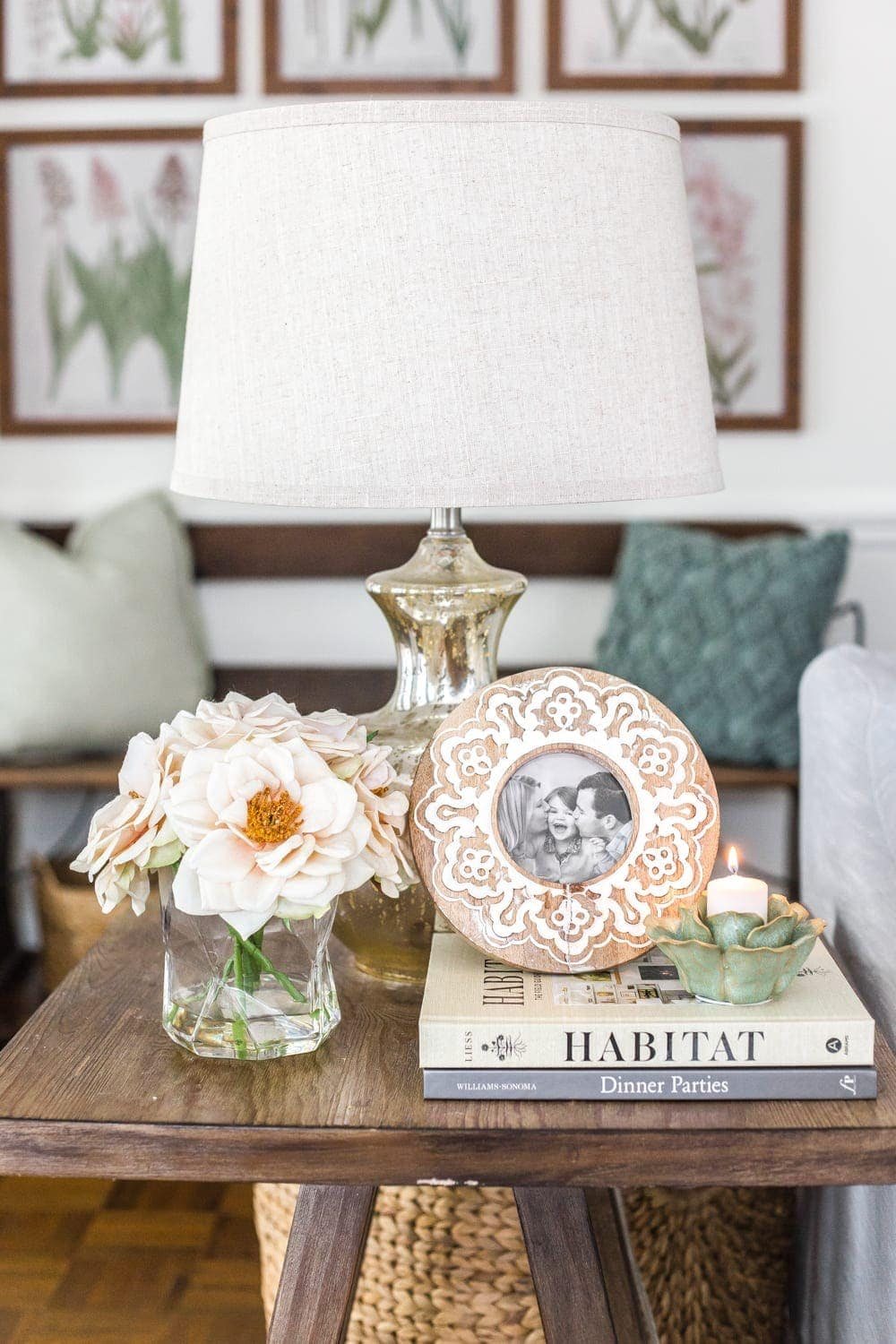 Simple Spring Home Tour | Neutral living room end table with artificial florals and small spring touches.