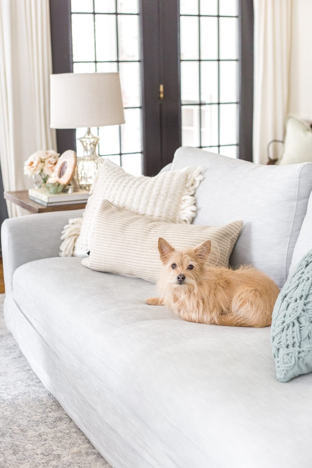Simple Spring Home Tour | Neutral living room with artificial florals and small spring touches.