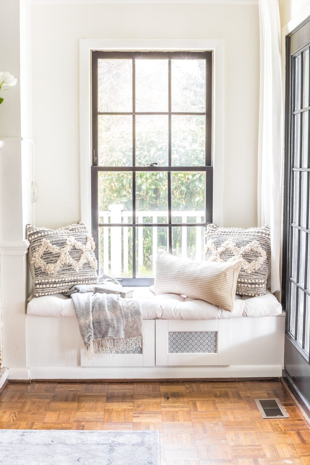 Simple Spring Home Tour | Neutral living room decorated with small floral touches for spring