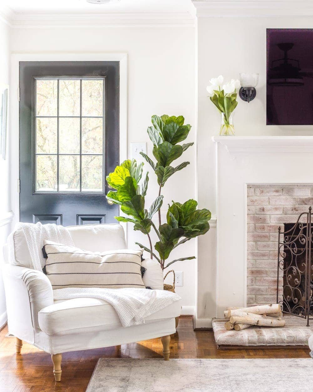 Simple Spring Home Tour | Neutral living room decorated with artificial fiddle leaf fig and IKEA furniture
