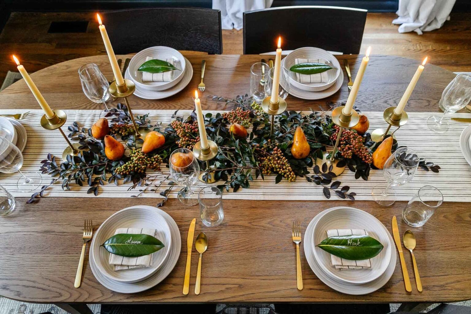 simple Thanksgiving centerpiece idea : candles, stems from the backyard, and pears