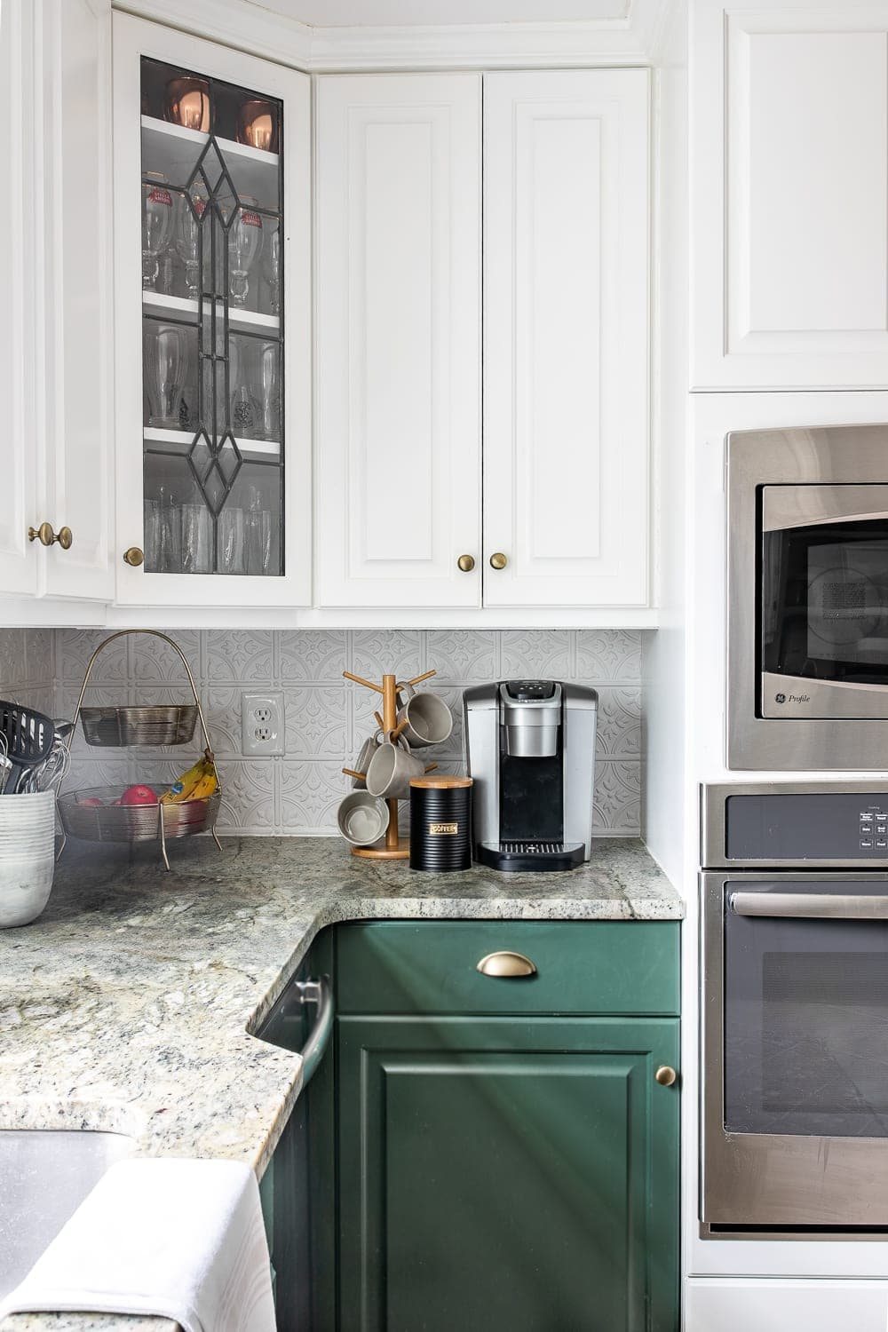 simple kitchen counter decor with fruit tiered tray and coffee station