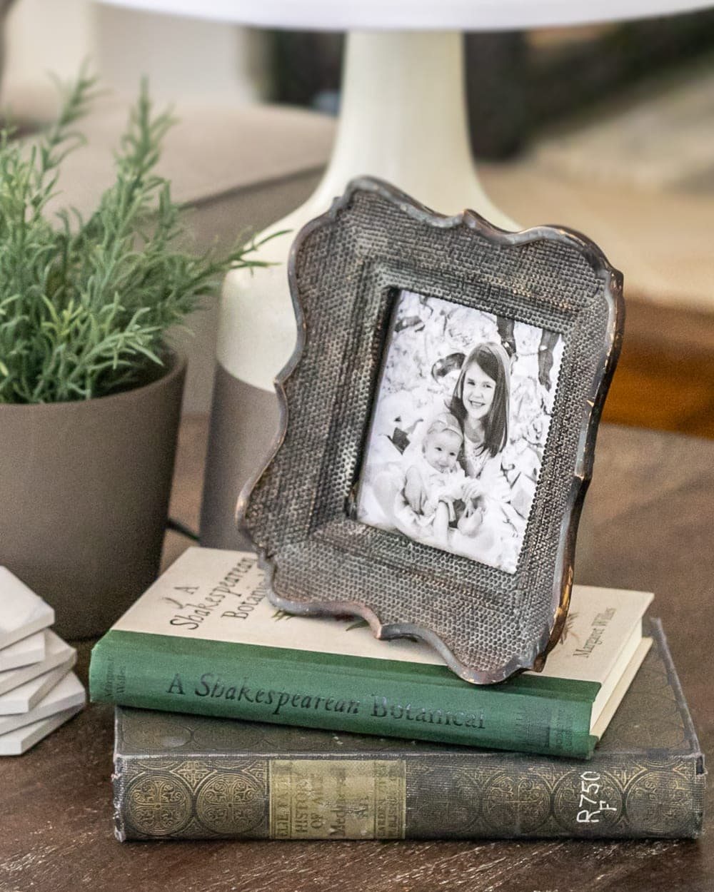 how to style end tables - using picture frames and books as risers