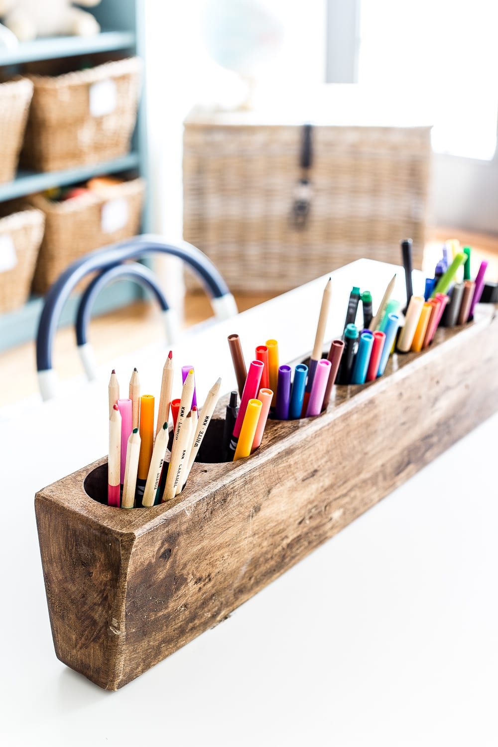 A dated, unorganized playroom gets a bright and whimsical makeover with organizational strategies, ideas for adding function, and DIY-able projects to create the perfect kid's space on a budget. #kidsroom #playroom #kidsdecor #toyorganizing