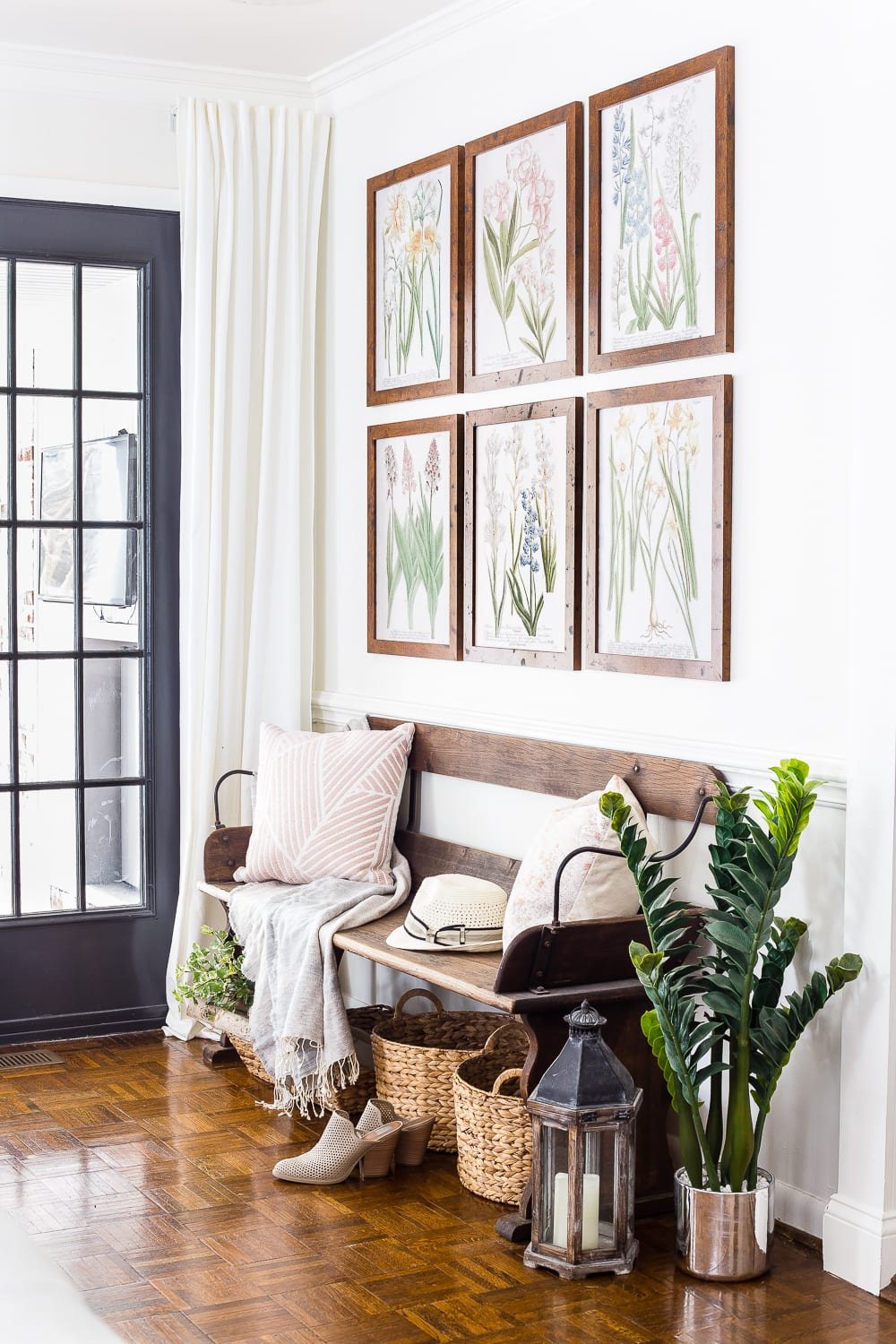 A living room gets a spring refresh with simple florals, candle light, and light fabrics. #springdecor #livingroom #springlivingroom #springaccents #livingroomdesign #livingroomdecor #budgetdecor