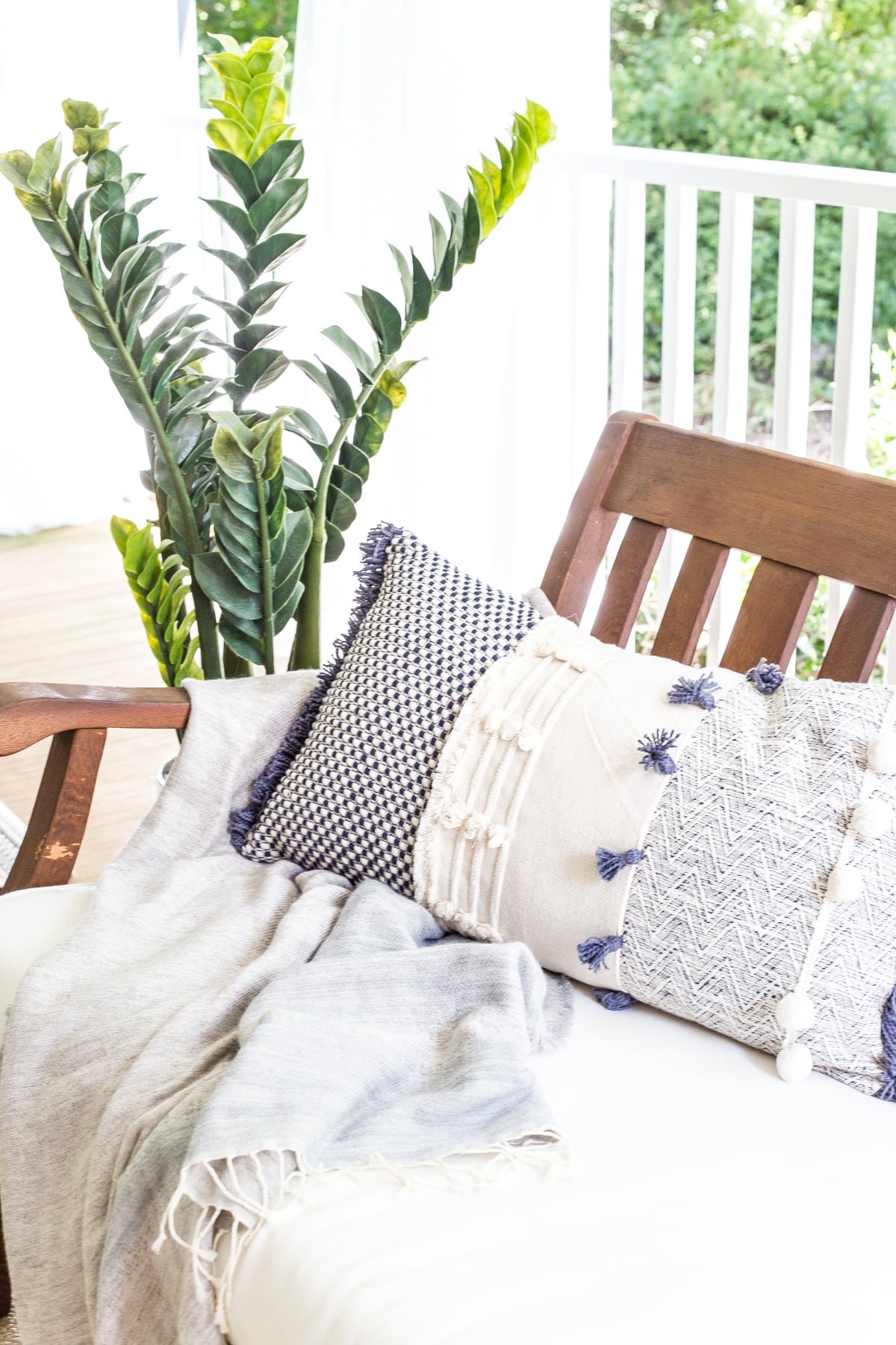 summer outdoor decor on back porch with throw pillow